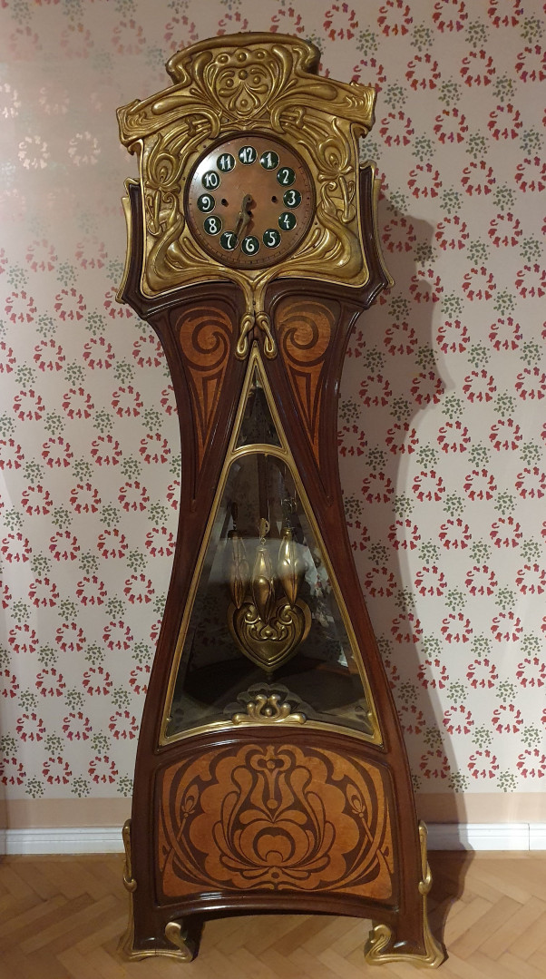 Art Nouveau style pendulum clock designed by Frigyes Spiegel, displayed in the György Ráth villa of the Museum of Applied Arts. Image by Balazs Hangya. Art Nouveau style pendulum clock designed by Frigyes Spiegel, displayed in the György Ráth villa of the Museum of Applied Arts. Image by Balazs Hangya.